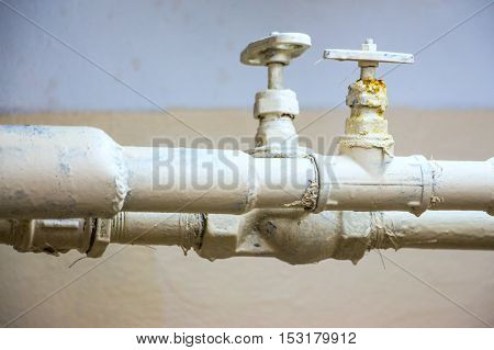 Two water pipes with valves. Pipes white