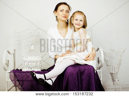 young mother with daughter at luxury home interior vintage, old fashion relashionship family