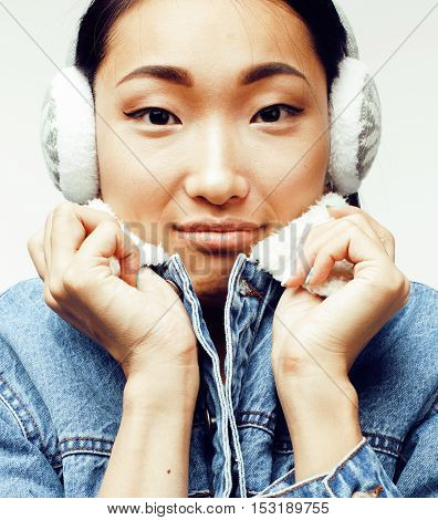 young pretty asian modern fashion hister woman in winter earphones posing cheerful emotional isolated on white background, lifestyle people concept close up