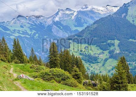 Beautiful Swiss mountain valley landscape with trail.