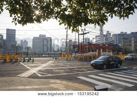 Nagasaki, Japan - February 28, 2016 Cars And Vintage Tram On The Road
