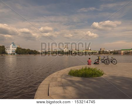 Embankment of the river Iset. Yekaterinburg city. Summer. Day. Cloudy. City landscape. Sverdlovsk region. Russia.