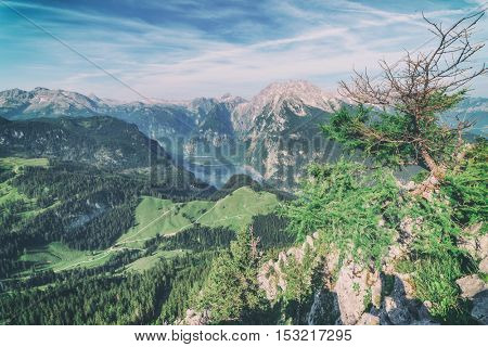 Beautiful view from top of cableway above the Konigsee lake on Schneibstein mountain ridge. Border of German and Austrian Alps, Europe. Toned like Instagram filter