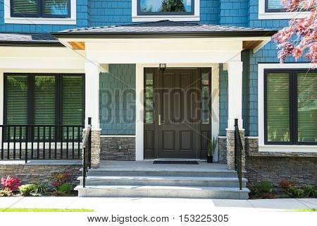 A nice entrance of a luxury house with flight of steps in front