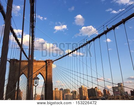 Brooklyn bridge and building of Manhattan city with blue sky, New York