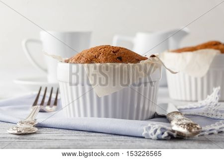 Cappuccino Coffee Cup With Muffin On White Table