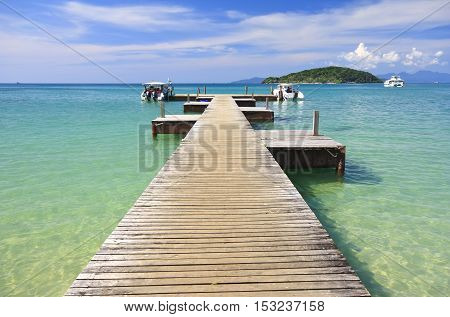 koh mak beach or mak island harbour and speed boat on clear sky and sea at Trat Province in Thailand