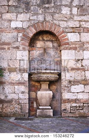 Ancient drinking fountain in Todi. Umbria, Italy
