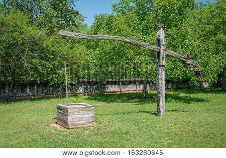 Shadoof in the garden. Rural detail .