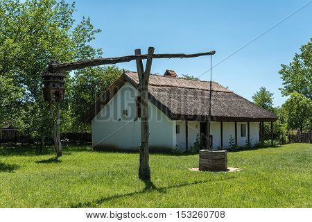 Shadoof in the garden. Rural detail .
