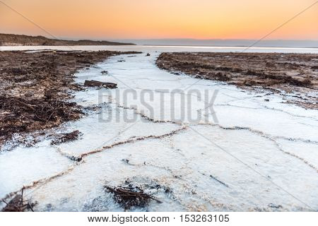 Cristal salt formation on the coast of Deas Sea Jordan at sunset.