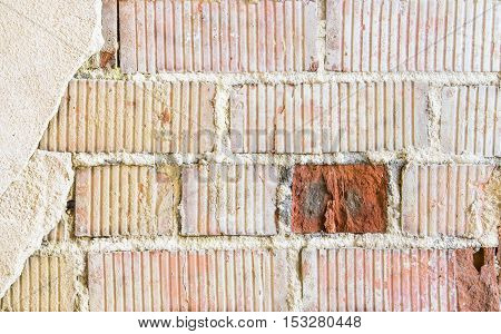 Old brick wall fragment with red brick accent for background