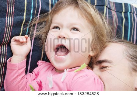 cheerful toddler and daddy having fun laughting very emotional