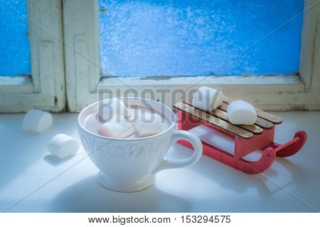 Homemade hot chocolate with marshmallows for Christmas in cold evening