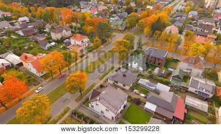 Street in auntumn in town by drone