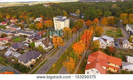 Street in auntumn in town by drone