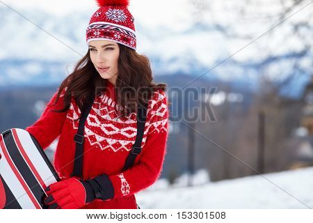 winter, leisure, sport and people concept - happy young woman in ski cothes outdoors