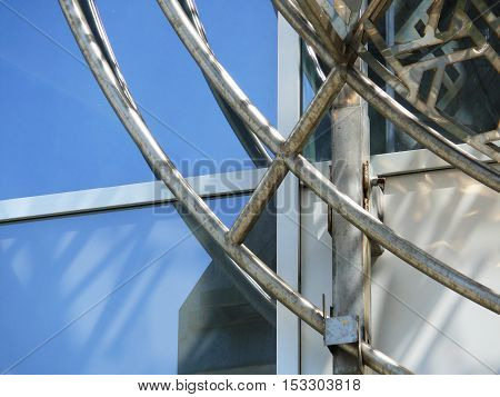 the metal structure on the facade of the building.
