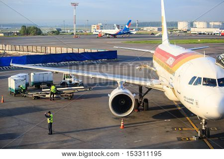 Moscow, Russia - May 27, 2016: Luggage loading of Iberia airlines aircraft before boarding  at the Domodedovo airport in Moscow, early morning