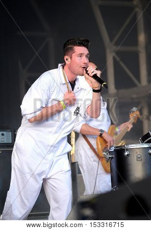 NEWPORT, ISLE OF WIGHT, UK - SEPTEMBER 11 2016: Lead singer Dan Smith performing on stage with Bastille at Bestival festival on the Isle of Wight