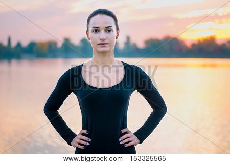 Young Woman Portrait In Morning At Sunrise Background
