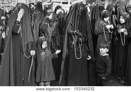 Istanbul Turkey - October 11 2016: Turkish Shia women takes part in an Ashura parade in Istanbul's district of Kucukcekmece. Turkish Shia Muslims mourning for Imam Hussain. Caferis take part in a mourning procession marking the day of Ashura in Istanbul's