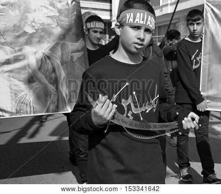 Istanbul Turkey - October 11 2016: Turkish Shia children takes part in an Ashura parade in Istanbul's district of Kucukcekmece. Turkish Shia Muslims mourning for Imam Hussain. Caferis take part in a mourning procession marking the day of Ashura in Istanbu