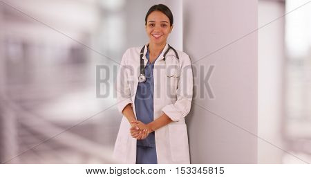 Mexican woman doctor standing in hospital hallway