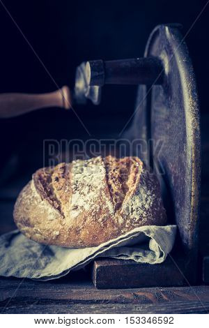 Slicing A Fresh Loaf Of Bread On The Slicer