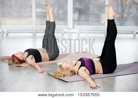 Senior Women Doing Double Straight Leg Lift Exercise