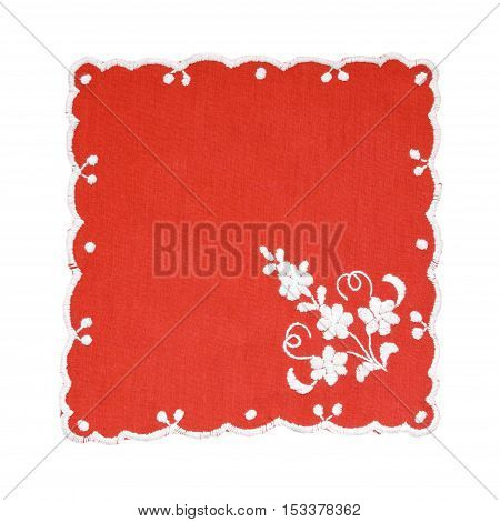 Embroidered red and white tablecloth isolated on white background