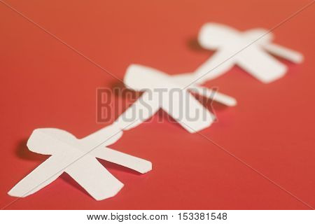 White paper people on a red background