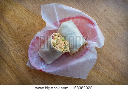 Korean fast food Bibimbap burrito with spicy kimchi