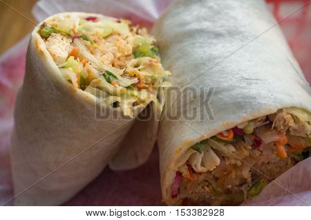 Korean fast food Bibimbap burrito with spicy kimchi