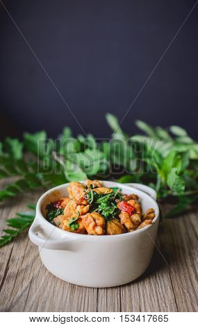 Kapro Kai, Stir Fried Basil Cicken on wooden Thai Famous Food Thai Street Food Thai Cuisine Thai Spicy Food