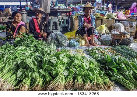 Kota Belud,Sabah-Oct 23,2016:Local trader selling various vegetables at a local market Tamu in Kota Belud,Sabah.Its a place where all farmers,fishermen & vendors gathers weekly to sell their products