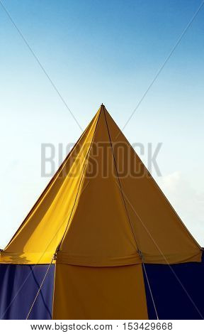 A big yellow medival theme tent standing.