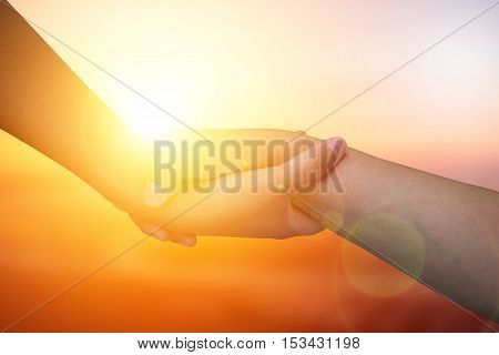 Closeup hands Used to help each other on background. The concept of Business. hands strong who have experience to help the people who are able to move on to greatness.two hold love team work office.