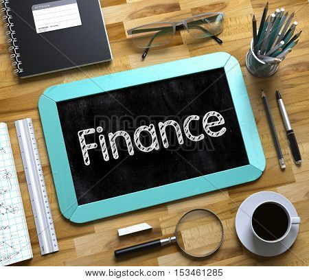 Small Chalkboard with Finance. Finance Handwritten on Mint Small Chalkboard. Top View of Wooden Office Desk with a Lot of Business and Office Supplies on It. 3d Rendering.