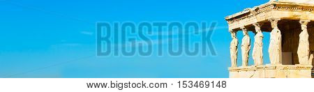 Banner background with Acropolis, Erechtheum Temple in Athens, Greece and blue sky