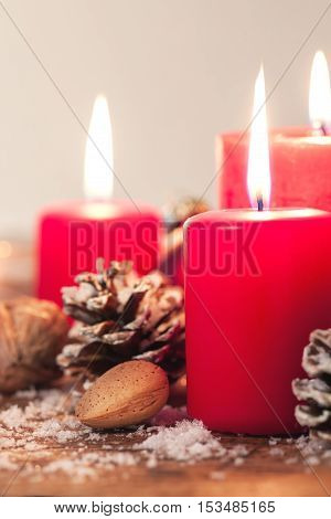 Christmas candles with christmas decorations christmas or new year atmosphere selective focus