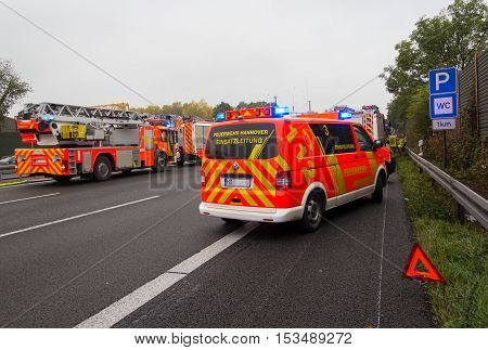 HANNOVER / GERMANY - OCTOBER 25 2016: german firefighting trucks stands on freeway a2 by a truck crash near Hannover.