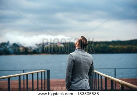 Men With Beard Smoking Electronic Cigarette Outdoor