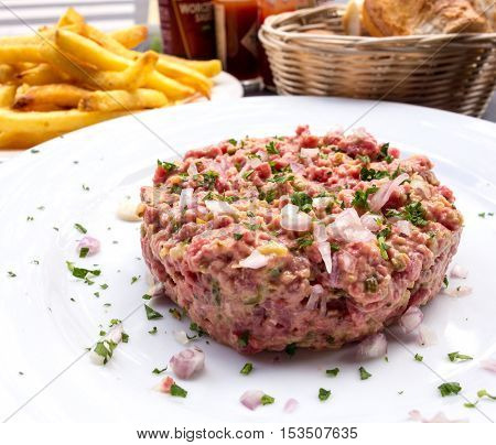 tasty Steak tartare (Raw beef) - classic steak tartare on white plate