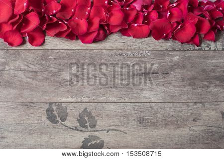 Red Rose Petals On The Wooden Background. Rose Petals Border On A Wooden Table. Top View, Copy Space