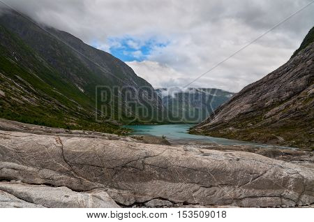 Mountain landscape with glacial river in Norway - Jostedalsbreen National Park in Briksdalen valley
