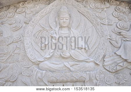 The Buddhist sea goddess Guanyin on a stone mural at Huayan Temple in Qingdao China in shandong province