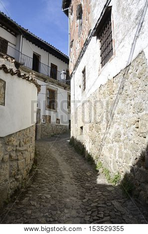 CANDELARIO, SPAIN - AUGUST 11, 2016: Stone steep street in the picturesque village of Candelario in the province of Salamanca Spain.