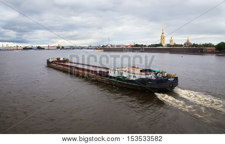St.Petersburg Russia - September 17 2016: Barge floats on the Neva against the background of the fortress. St. Petersburg