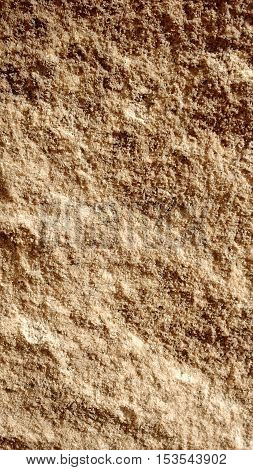 An old uneven stone wall texture closeup